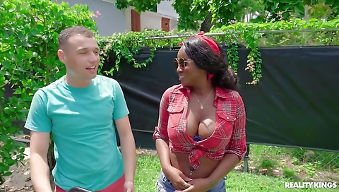 Two hot lesbians fucking on the bed with strapon dildo